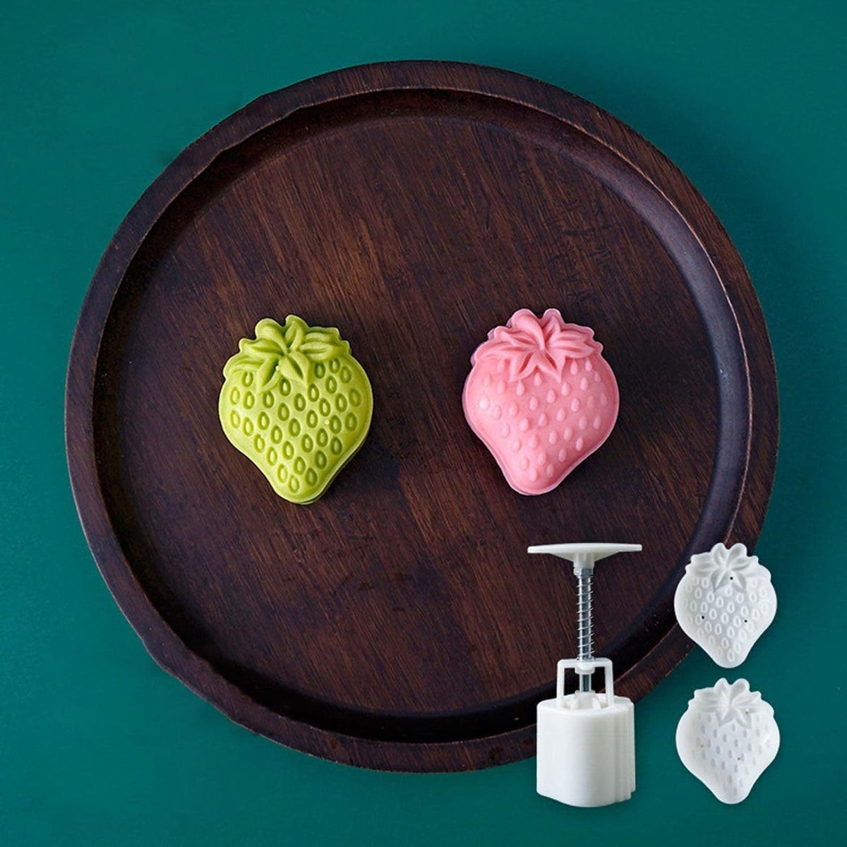 Plastic mooncake mold stamp with strawberry design for DIY baking, suitable for pretend play and creative cooking activities.