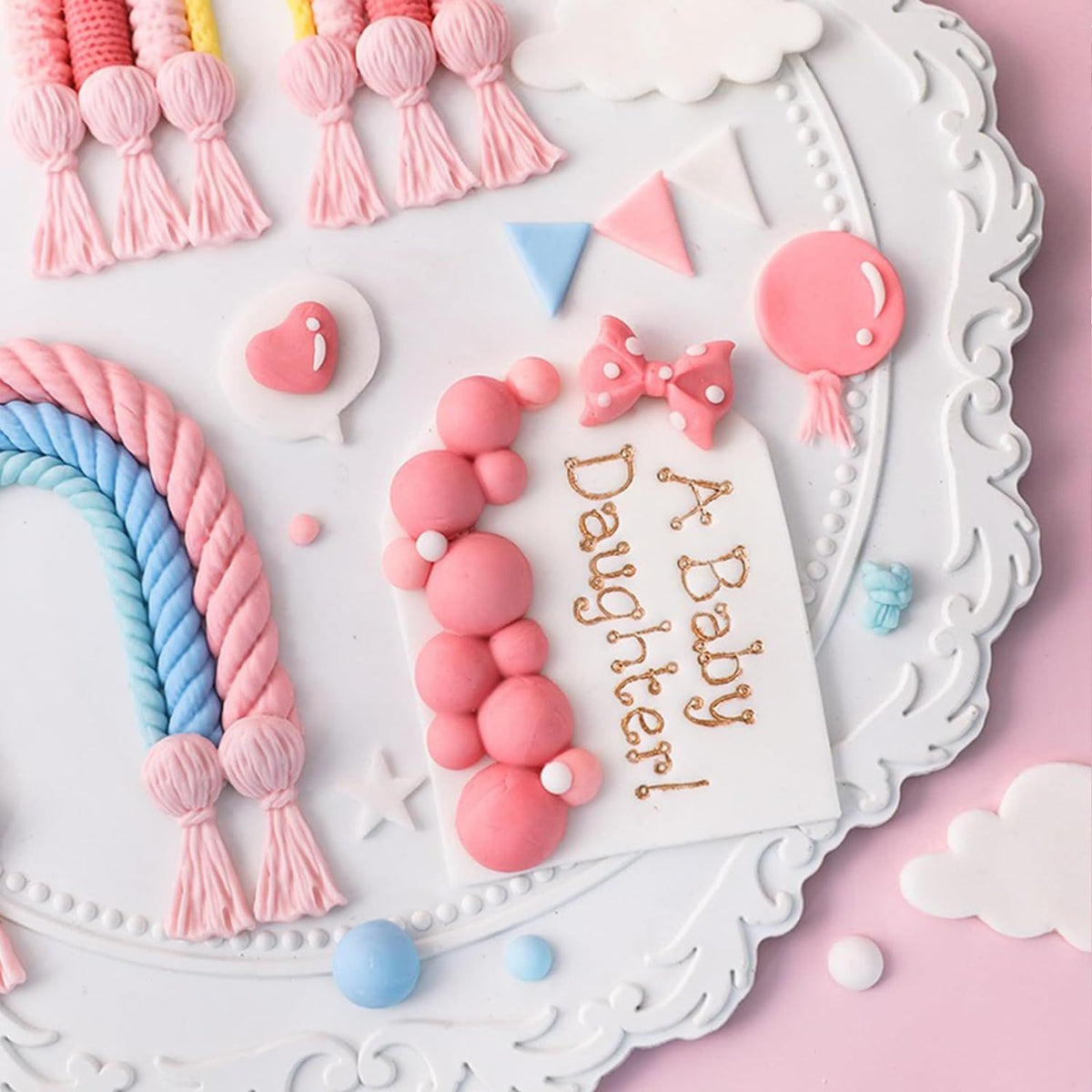 Hemispherical pearl and heart-shaped silicone molds for bubble cake decorating, perfect for cupcake toppers and desserts.