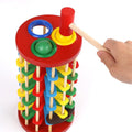 Wooden ball drop toy for kids with hammer and ramp, educational Montessori-style outdoor play toy for babies and children.