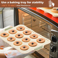 Beige silicone muffin pan with 12 nonstick cupcake molds, ideal for baking muffins and cupcakes.