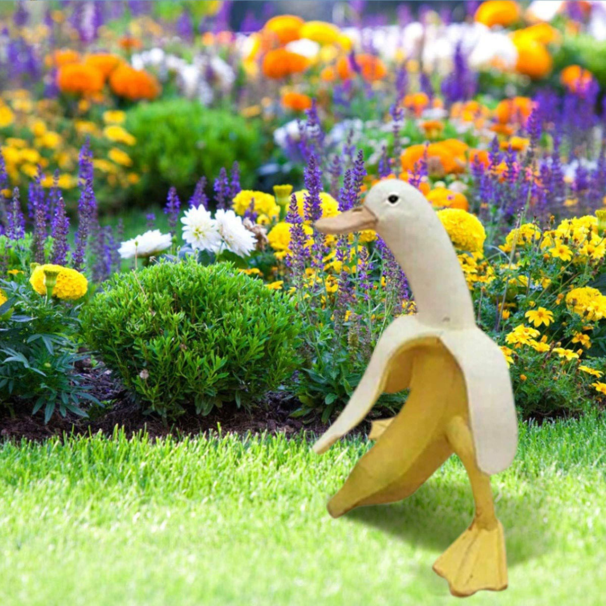 Whimsical duck sculpture with a banana body, outdoor garden yard art, creative duck toy for kids, by Everything Baby