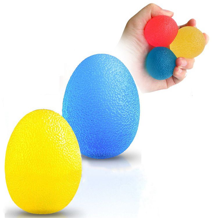 Three colorful stress relief balls for hand exercise and therapy, shown in a playful setting suitable for kids and babies.