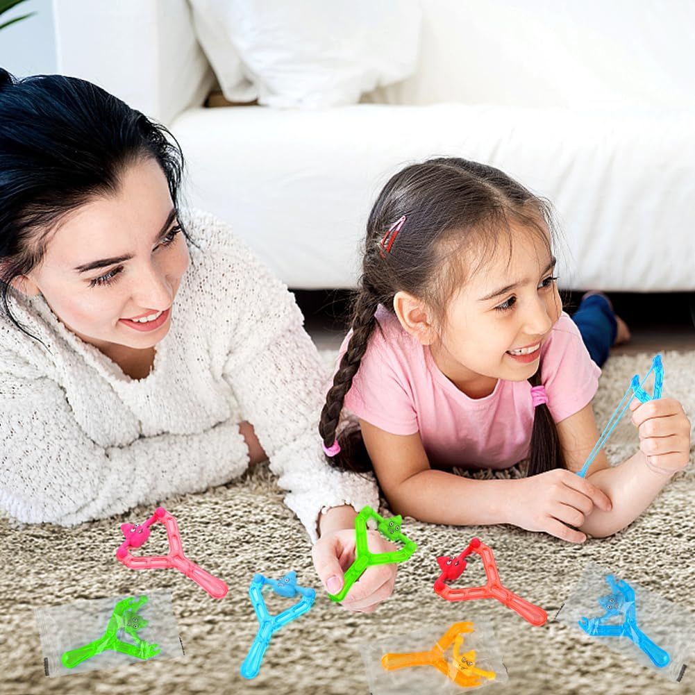 Set of 5 mini rubber finger flying poop toys for kids and adults, fun stress relief prank squishy toys for pretend play and party gifts.