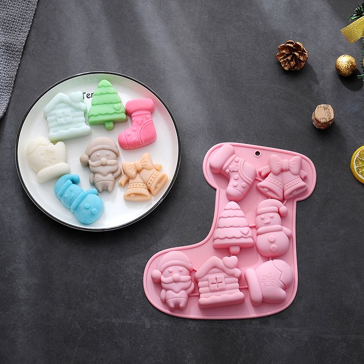 Two silicone Christmas molds for chocolates, jellies, and soap, featuring festive holiday designs for baking and crafts.