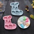 Two Christmas silicone molds for chocolates, jellies, and soaps, featuring festive holiday designs, non-stick baking surface.