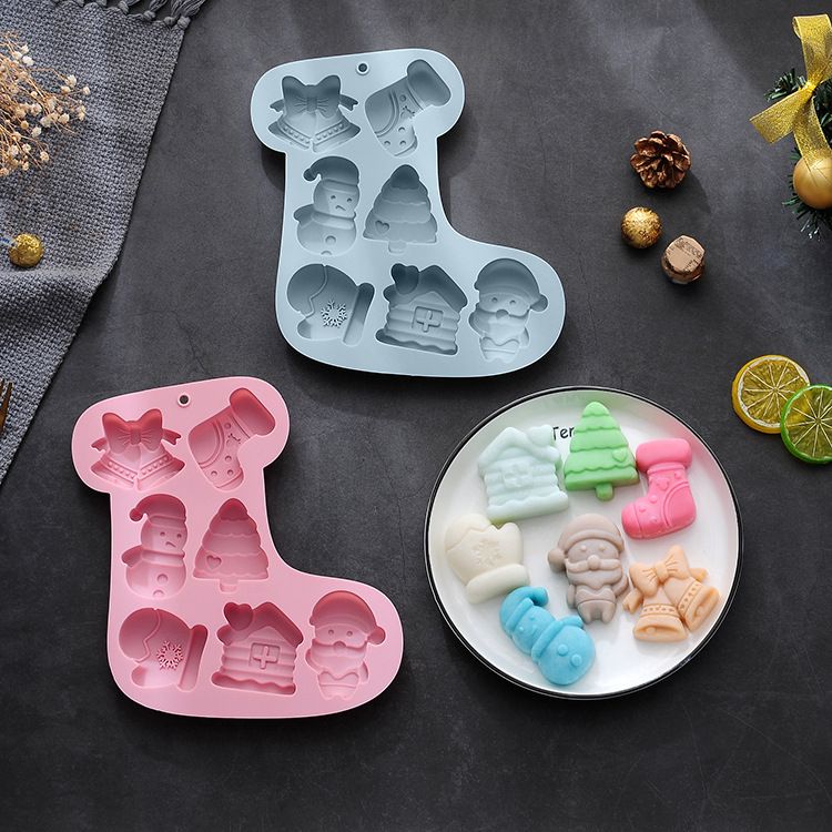 Two Christmas silicone molds for chocolates, jellies, and soaps, featuring festive holiday designs, non-stick baking surface.