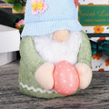 Two handmade Easter Bunny gnome plush dolls with Easter eggs, perfect for spring decor and children's pretend play.
