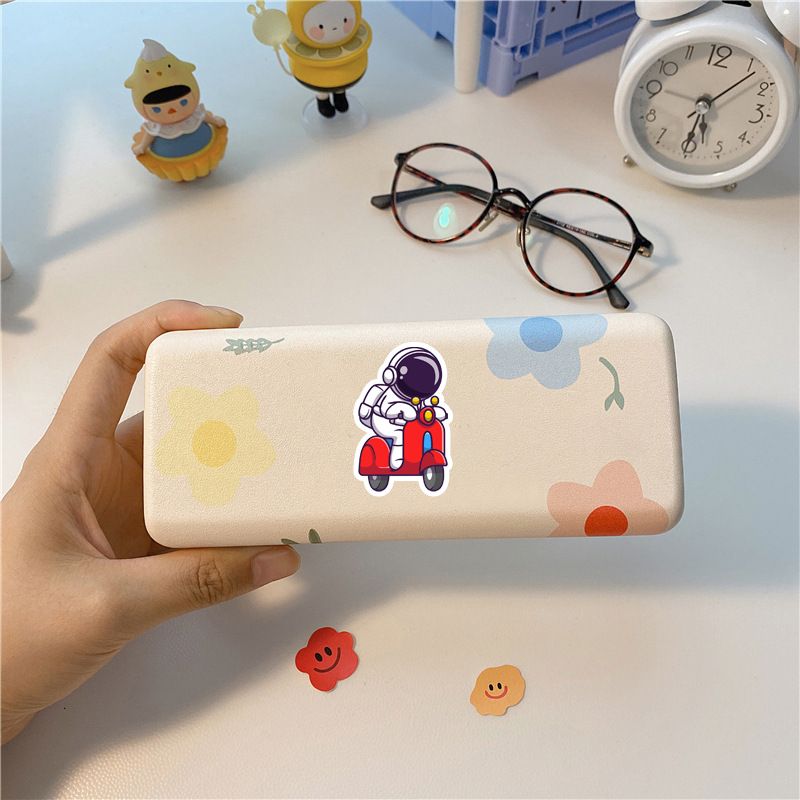 Set of 83 colorful cartoon astronaut stickers for kids, waterproof vinyl decals perfect for laptops, tablets, and pretend play.