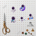 Set of 83 waterproof vinyl astronaut stickers for kids, featuring colorful space-themed designs for laptops and tablets.