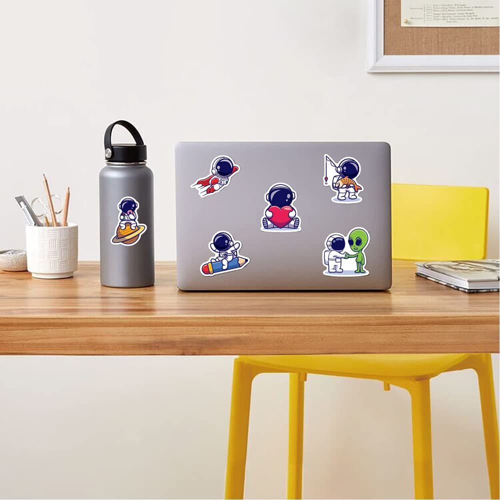 Set of 83 waterproof vinyl astronaut stickers for boys and girls, featuring colorful astronaut designs for laptops and tablets.