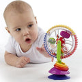 Colorful baby feeding ferris wheel toy with rotating rings and suction cup for one-year-old children, designed for kids' tables and seats.