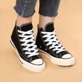 Three pairs of navy and white flat shoelaces for boys' sneakers, ideal for athletic running shoes and casual footwear.