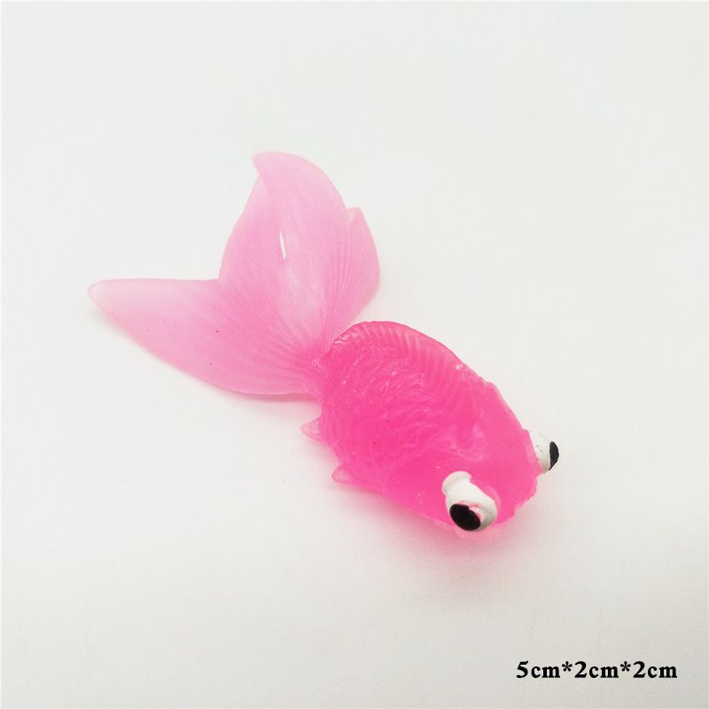 Five colorful plastic fake goldfish ornaments for aquariums, realistic moving fish toys for kids and decorative display.