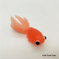 Five colorful plastic fake goldfish ornaments for aquariums, realistic moving fish decorations for kids' toy displays.
