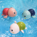 Little turtle baby bath toy set by Everything Baby, children playing in water with colorful turtle toys for kids' bath time fun.