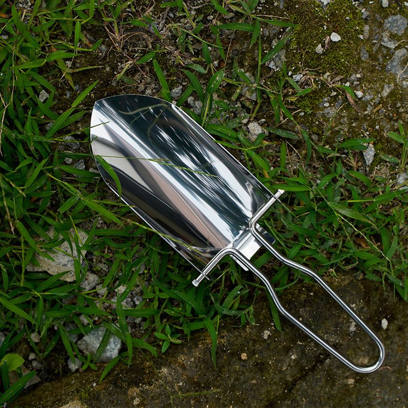 Foldable stainless steel outdoor shovel for kids, versatile gardening and ice digging tool, portable and durable for outdoor play.