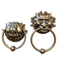 Set of two bronze door handles featuring whimsical dragon face designs, wall-mounted decorative door carvings for home decor.
