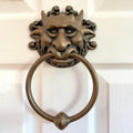 Set of two bronze wall-mounted dragon face door handles with whimsical carvings, suitable as decorative home gift statues