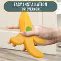 Cute banana-shaped door draft stopper wedge by Everything Baby, designed as a fun, fruit-shaped door stop for kids' pretend play.