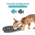 Fish-shaped silicone puzzle feeder and treat mat for dogs and cats, promoting healthy eating and reducing anxiety.