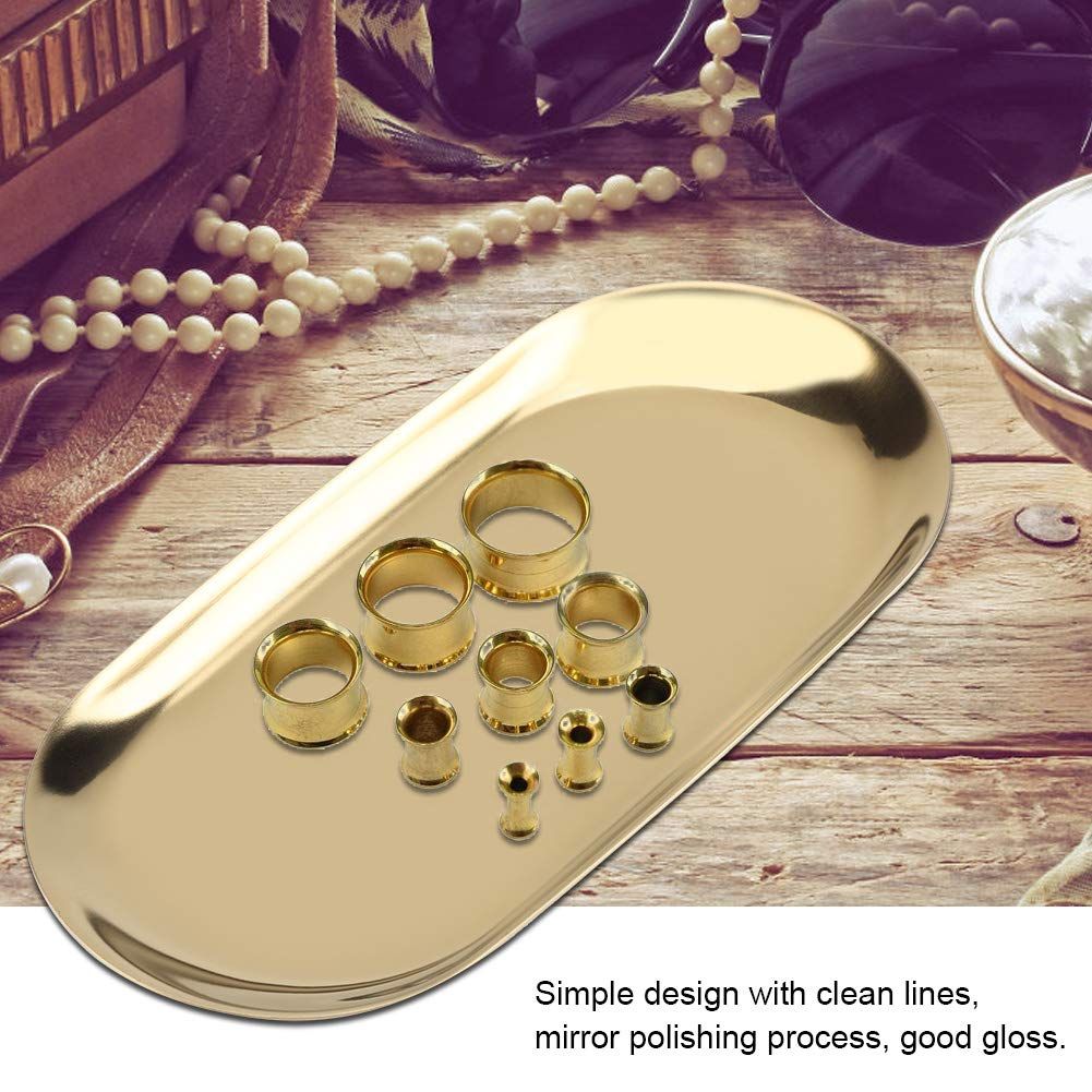 Gold oval stainless steel tray with decorative design, ideal for jewelry, perfume, or bathroom vanity display.