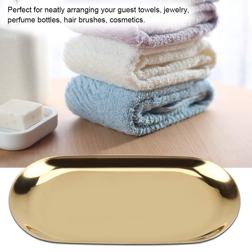 Gold decorative oval stainless steel tray, ideal for jewelry, perfume, or vanity organization in a bathroom or nursery.