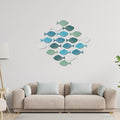 Set of 20 wooden fish wall decor pieces for kids' room, wooden school of fish beach-themed hanging art by Everything Baby.