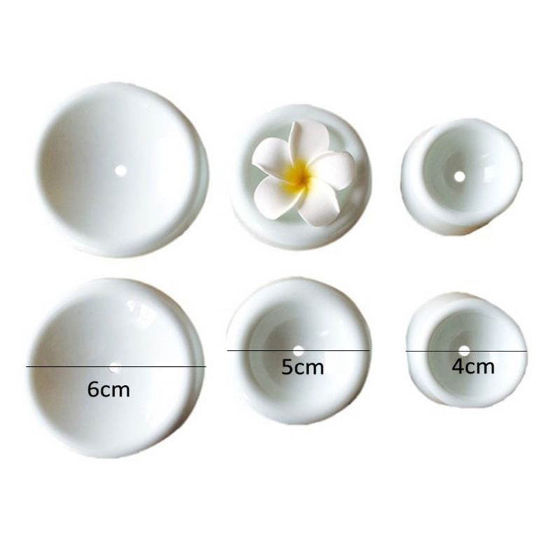 Baby nursing and feeding product, featuring 4 forming cups button-shaped drying holder for sugar flowers, fondant, and gumpaste molding.