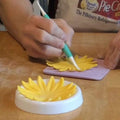 Button-shaped forming cups for sugar flowers, fondant, and chocolate shaping, ideal for cake decorating and baking.