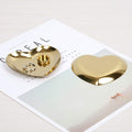 Heart-shaped stainless steel jewelry and gift tray with a Nordic design, ideal for displaying necklaces, rings, or desserts.