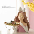 Cute girl sculpture porch decor tray holding miniature toys, modern kid's ornament for pretend play and decorative display.