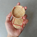 Two woven bamboo food storage trays with handles, ideal for snacks, cupcakes, and fruit, perfect for baby and kids feeding.