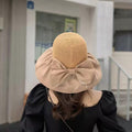 Foldable baby and kids sun hat with anti-UV ribbon, packable straw design for beach shade, by Everything Baby.
