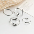 Sterling silver women's wrap cuff jewelry set with simple band design, hypoallergenic and adjustable, perfect for summer beach wear.