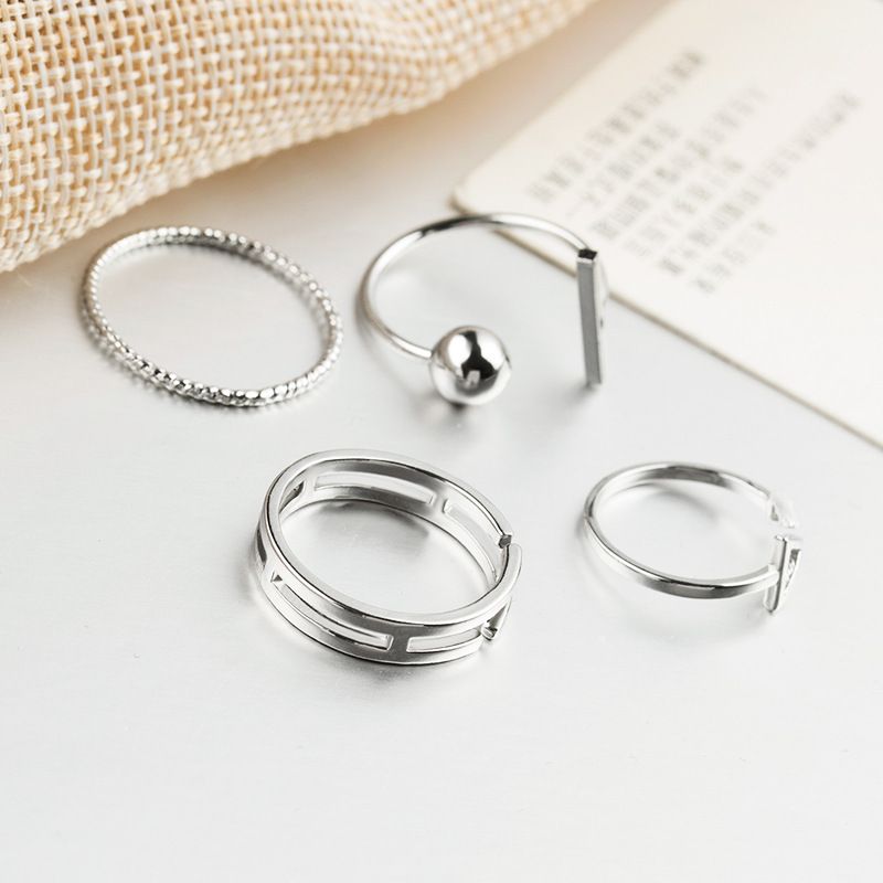 Sterling silver women's wrap cuff jewelry set with simple band design, hypoallergenic and adjustable, perfect for summer beach wear.