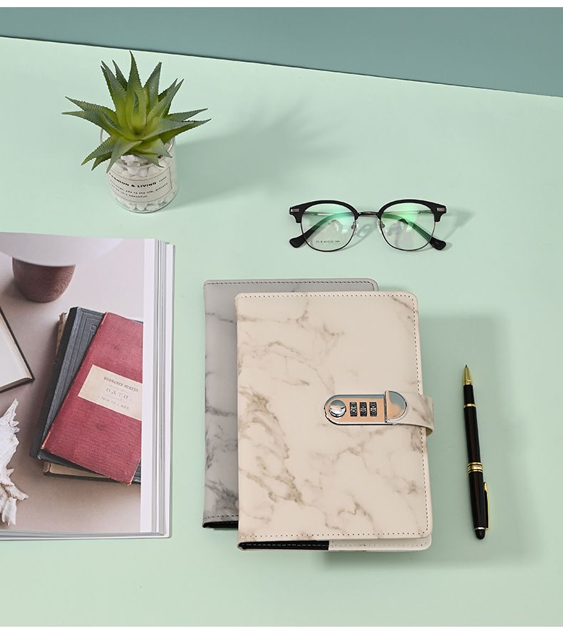 Three marble-patterned lockable kid's journals with 100 pages, waterproof cover, designed for kids' back-to-school use.