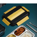 Stainless steel bento lunch box with 4 compartments, insulated bag and cutlery, designed for adults and work meals.
