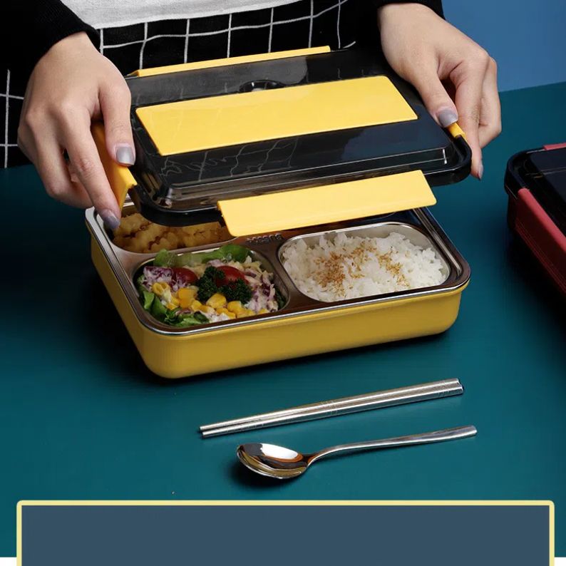 Stainless steel bento box with four compartments, insulated bag, and cutlery, designed for adults and work lunches.