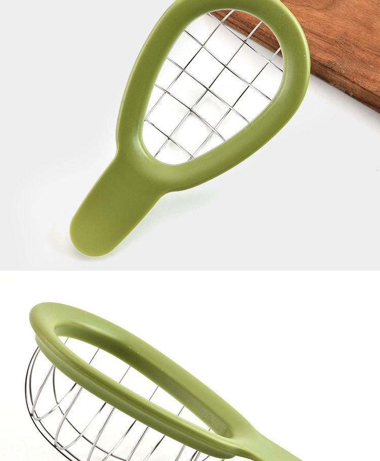 Stainless steel avocado cube maker and fruit cutter with avocado slicer, kiwi dicer, and peeler on kitchen countertop.
