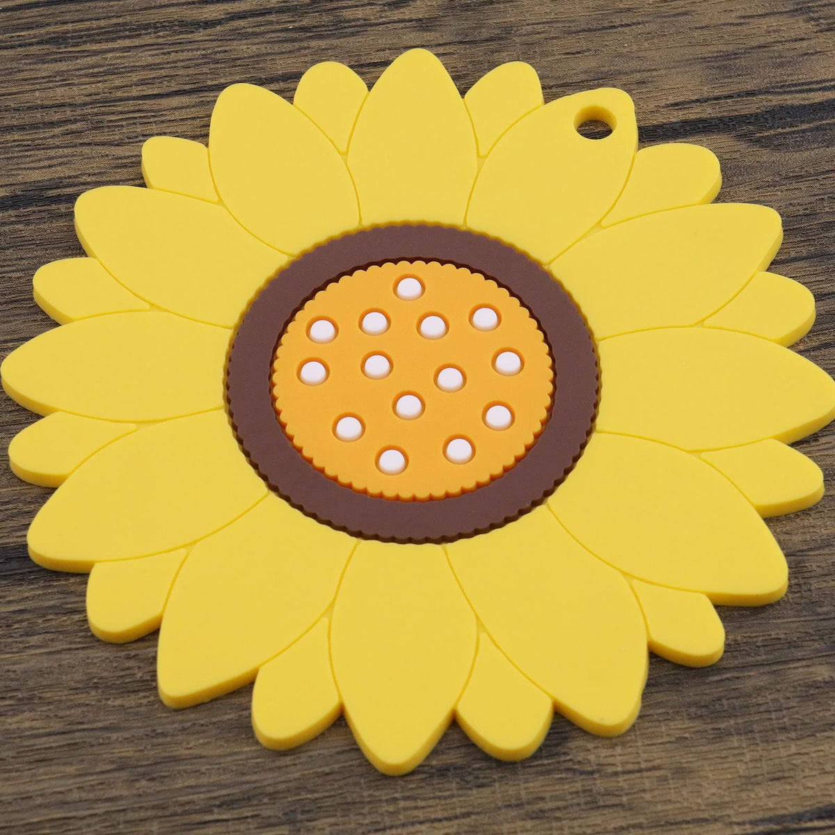 Set of three yellow sunflower-shaped coasters with flower design, heat insulation mats for hot and cold drinks, home table accessories.