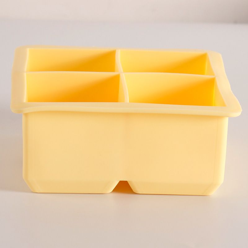 Two BPA-free silicone large ice cube trays with removable lids, stackable and easy to release, suitable for baby feeding and drinks.