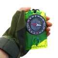 Child using Everything Baby orienteering compass during outdoor play, demonstrating camping navigation for kids and scouts.