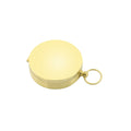Gold brass pocket compass for camping and outdoor navigation, suitable for wilderness hiking and survival adventures.