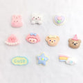 Set of 20 unisex baby and kid shoe charms featuring resin cartoon flowers and pearl chains for Crocs sandals and casual shoes.