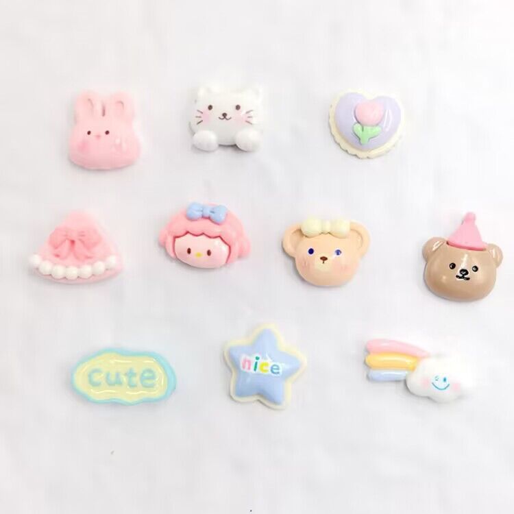 Set of 20 unisex baby and kid shoe charms featuring resin cartoon flowers and pearl chains for Crocs sandals and casual shoes.