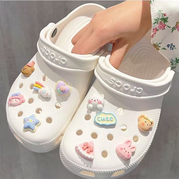 Set of 20 unisex shoe charms featuring resin cartoon flowers and pearls, designed for Crocs sandals and kids' footwear.