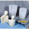 Silicone mold of a human body shape for candles, depicting naked women and men, used for body art and craft projects.