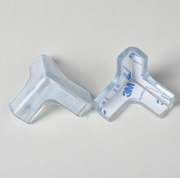 Set of four transparent silicone corner protectors for baby tables, designed to prevent injury and enhance child safety.