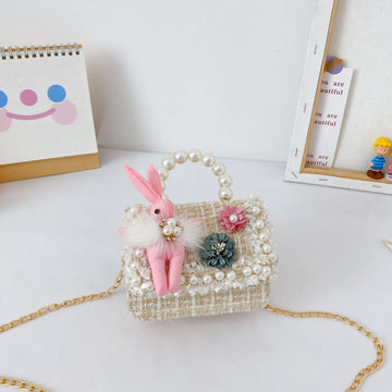 Cute girls princess purse with crown design, pearl handle, bunny cartoon details, perfect for toddlers and young kids.