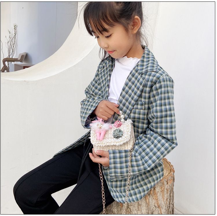 Cute girls' princess purse with crown design, pearl handle, bunny motif, and cartoon style crossbody bag for kids.